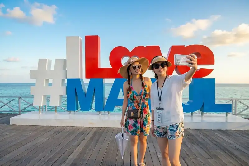 Iconic photo spot at the I Love Mabul sign on Mabul Island Sagittarius Resort