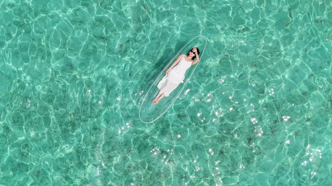 Guest enjoying a kayaking session in the turquoise sea Sagittarius Resort